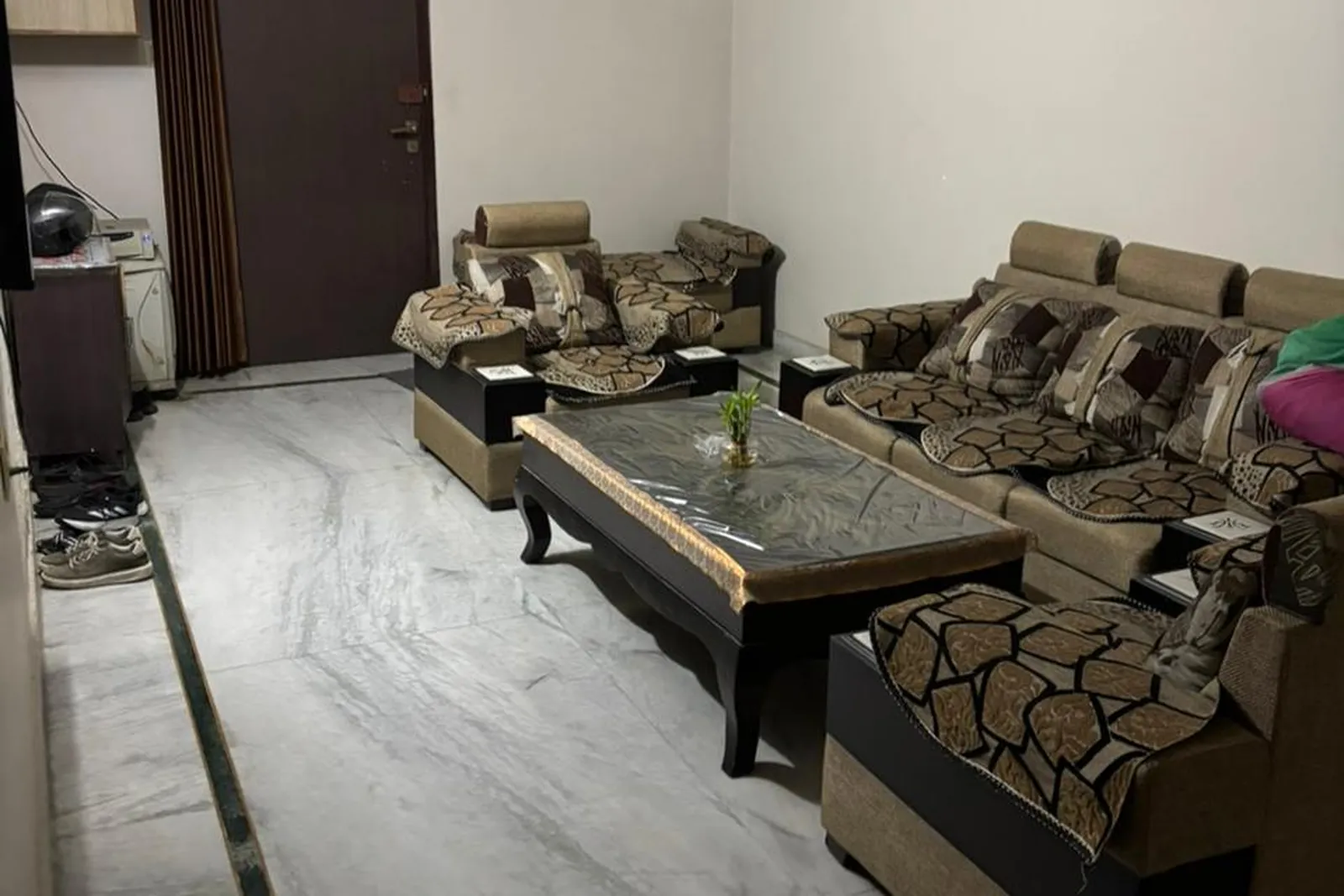 A furnished family living room restaged, original photo before virtual staging